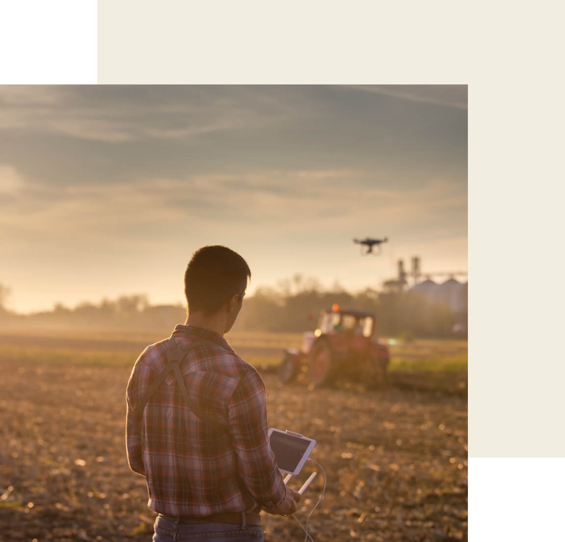 A farmer using a drone over his field