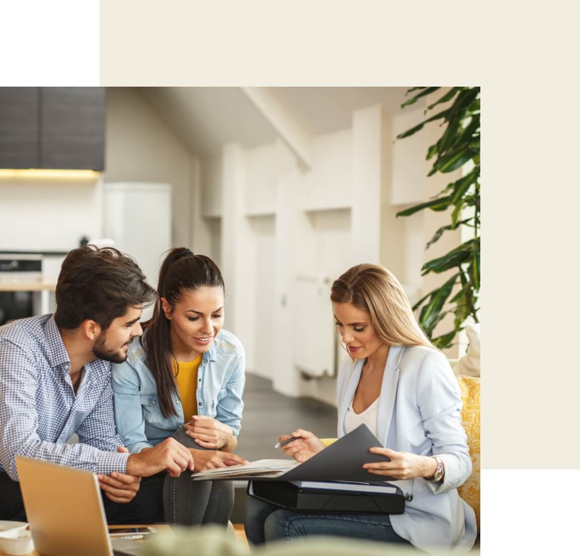 A real estate agent sitting down with some prospective buyers